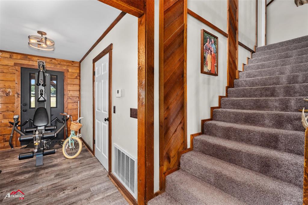 10073 Ferry Lake Road Oil City, LA 71061 - Photo 15 of 39 a view of an entryway with wooden floor and door