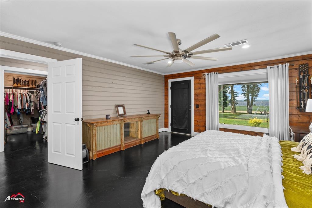 10073 Ferry Lake Road Oil City, LA 71061 - Photo 17 of 39 a view of a livingroom with furniture hardwood floor and a ceiling fan