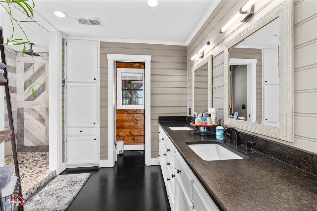 10073 Ferry Lake Road Oil City, LA 71061 - Photo 18 of 39 a kitchen with granite countertop a sink stove and cabinets