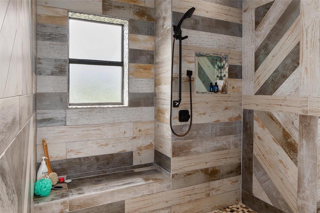 10073 Ferry Lake Road Oil City, LA 71061 - Photo 20 of 39 a bathroom with a shower
