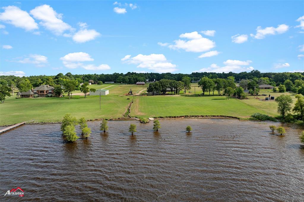 10073 Ferry Lake Road Oil City, LA 71061 - Photo 36 of 39 a view of a lake with a big yard