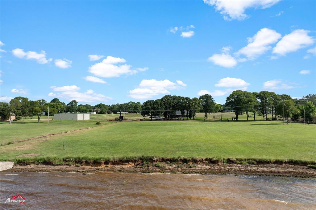 10073 Ferry Lake Road Oil City, LA 71061 - Photo 37 of 39 a view of a field with a lake