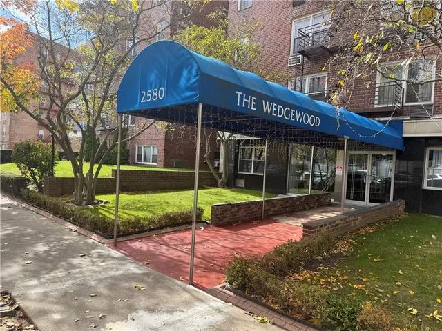 a view of a house with backyard porch and sitting area