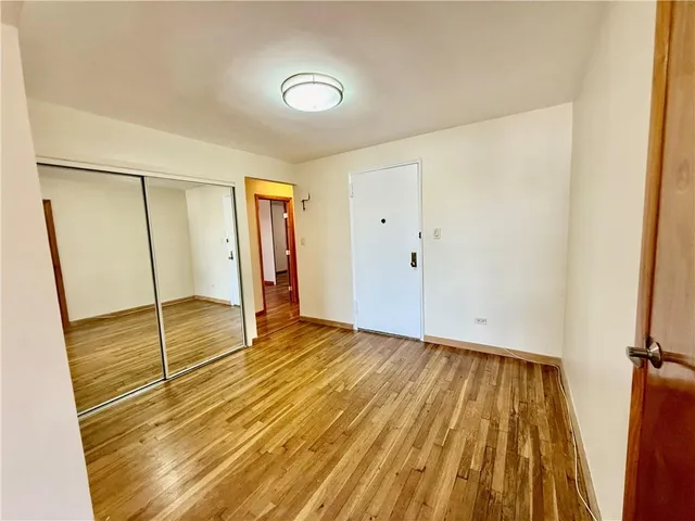 a view of an empty room with glass door