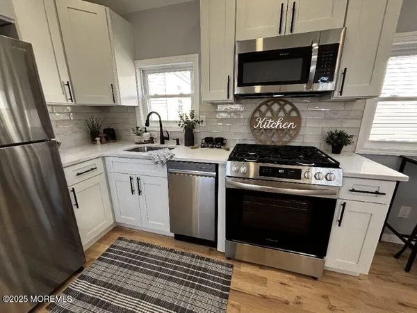a kitchen with a stove and a microwave