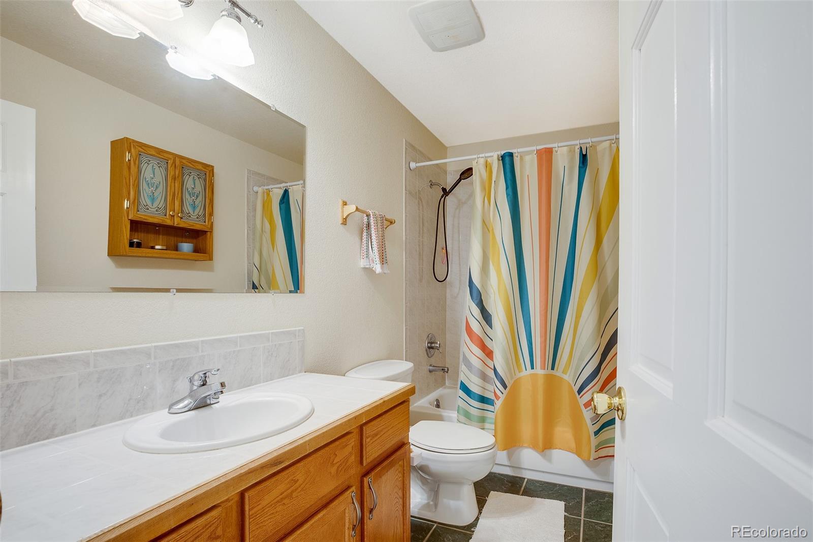 119 Bristlecone Lane Fairplay, CO 80440 - Photo 12 of 49 a bathroom with a sink a toilet and a mirror