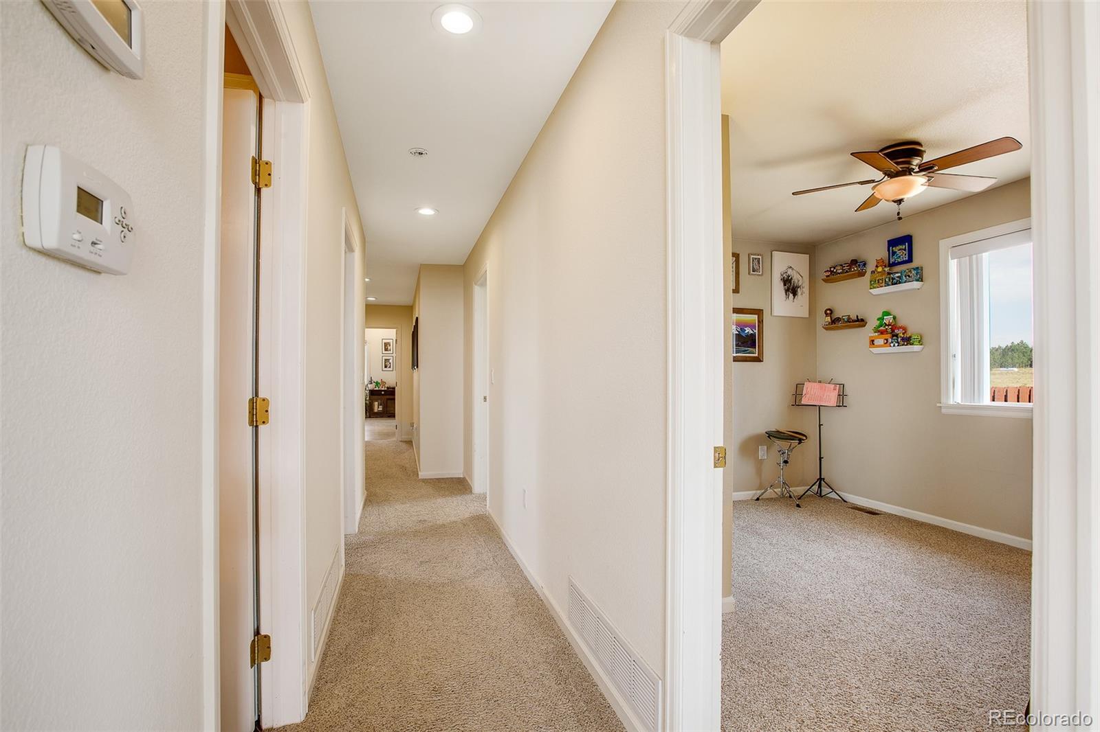 119 Bristlecone Lane Fairplay, CO 80440 - Photo 44 of 49 a view of a hallway view with wooden floor and staircase