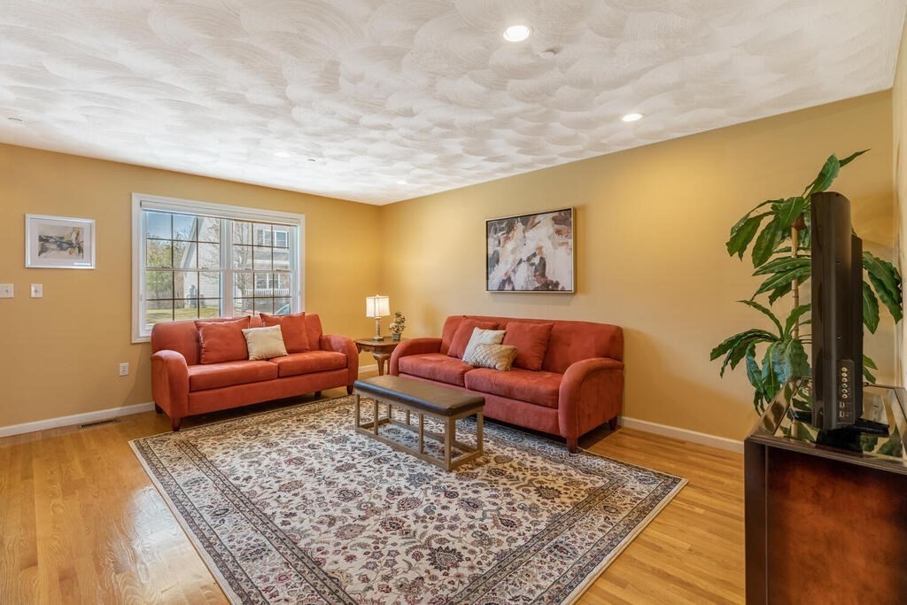 159 Allen Road, Unit 49 Billerica, MA 01821 - Photo 5 of 33 a living room with furniture and a rug