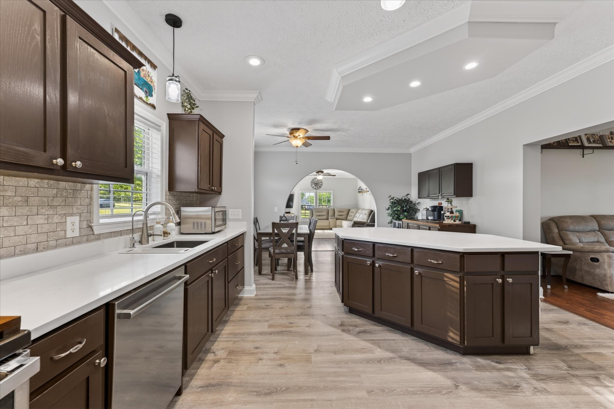 2108 Buckskin Court Spring Hill, TN 37174 - Photo 11 of 39 a kitchen with stainless steel appliances granite countertop a sink counter space cabinets and living room view