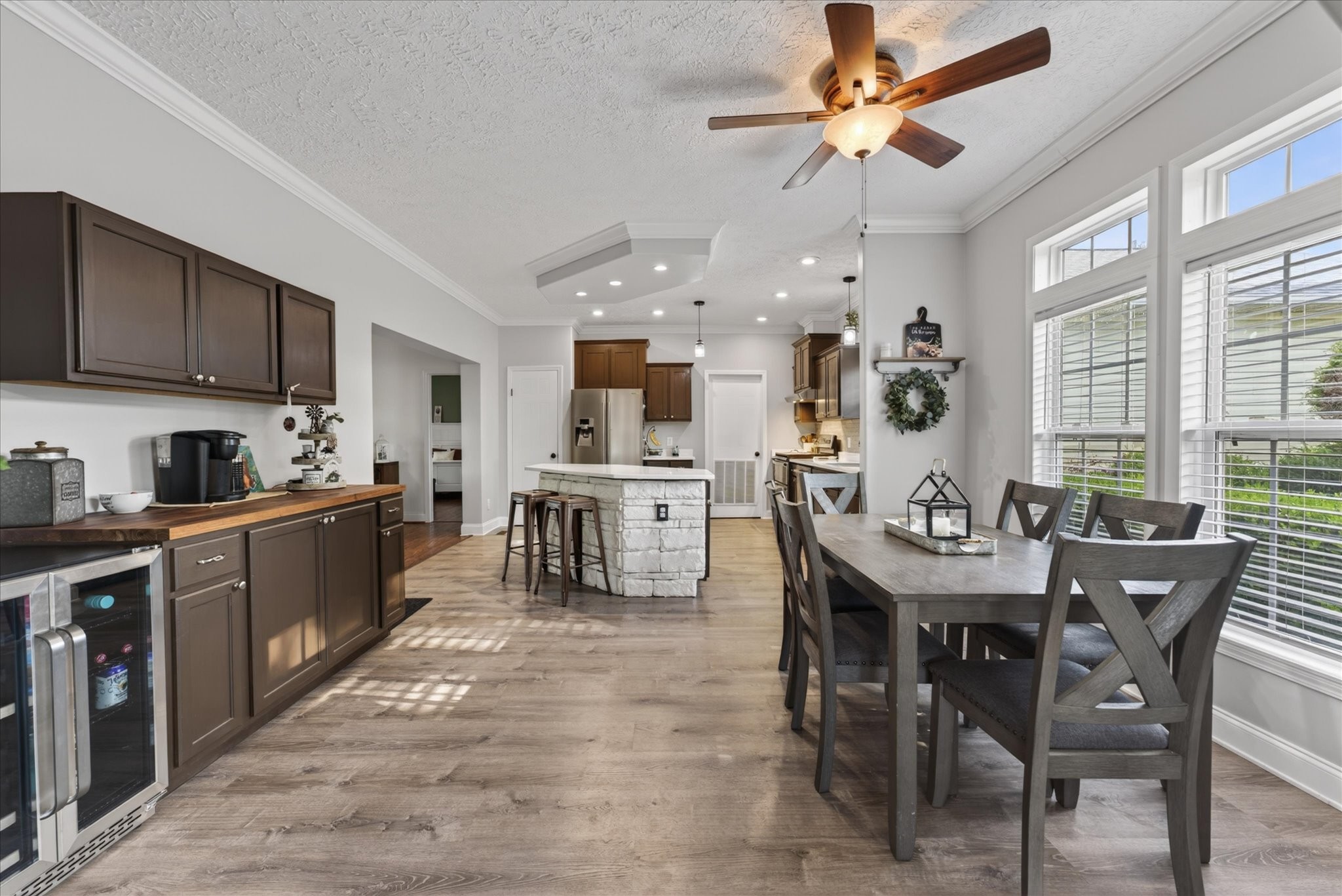2108 Buckskin Court Spring Hill, TN 37174 - Photo 7 of 39 a kitchen with stainless steel appliances kitchen island granite countertop a sink table and chairs