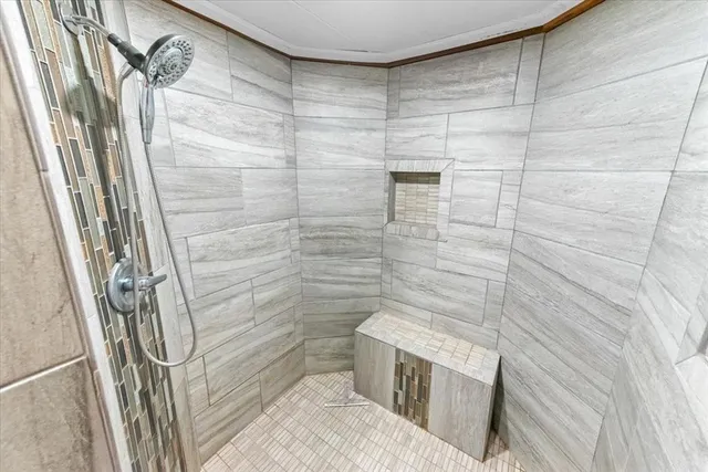 a bathroom with a shower and toilet