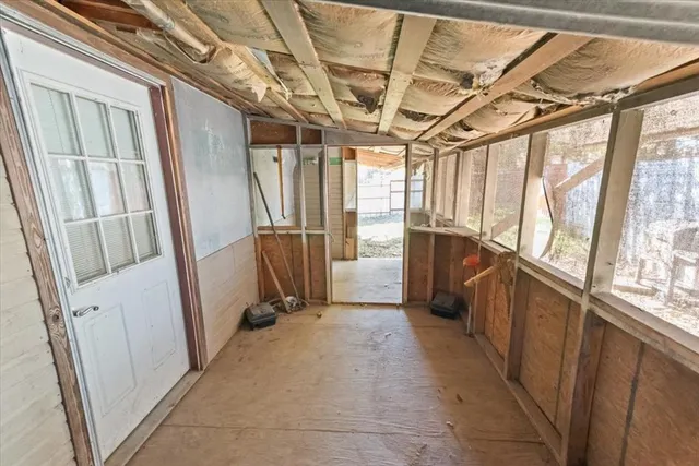 a view of entryway with wooden walls