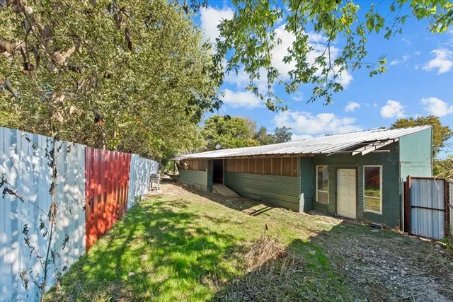 a backyard of a house with lots of green space