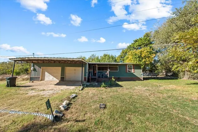 a house with yard in front of it
