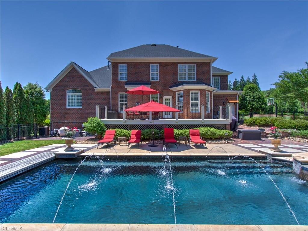 8404 Oakchester Court Oak Ridge, NC 27310 - Photo 1 of 30 Amazing backyard with custom salt water pool and spa built by David Meredith. Both can be separately heated.