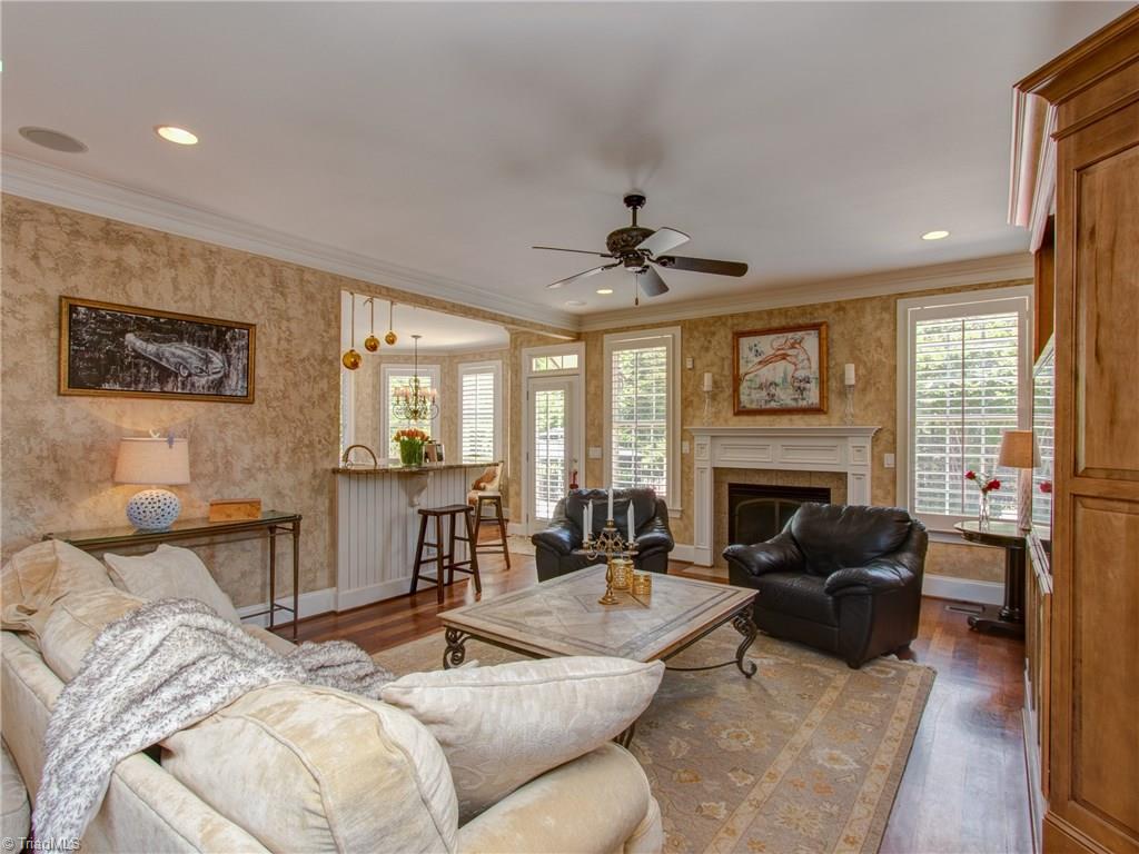 8404 Oakchester Court Oak Ridge, NC 27310 - Photo 12 of 30 Great room with crown molding, recessed lighting, gas lock fireplace and recessed speakers.