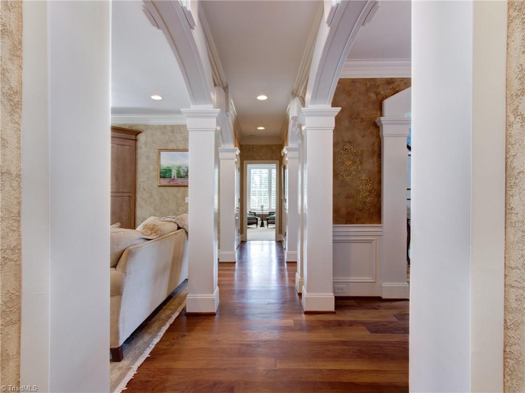 8404 Oakchester Court Oak Ridge, NC 27310 - Photo 17 of 30 Hall with beautiful molding, coat closet and recessed lighting.