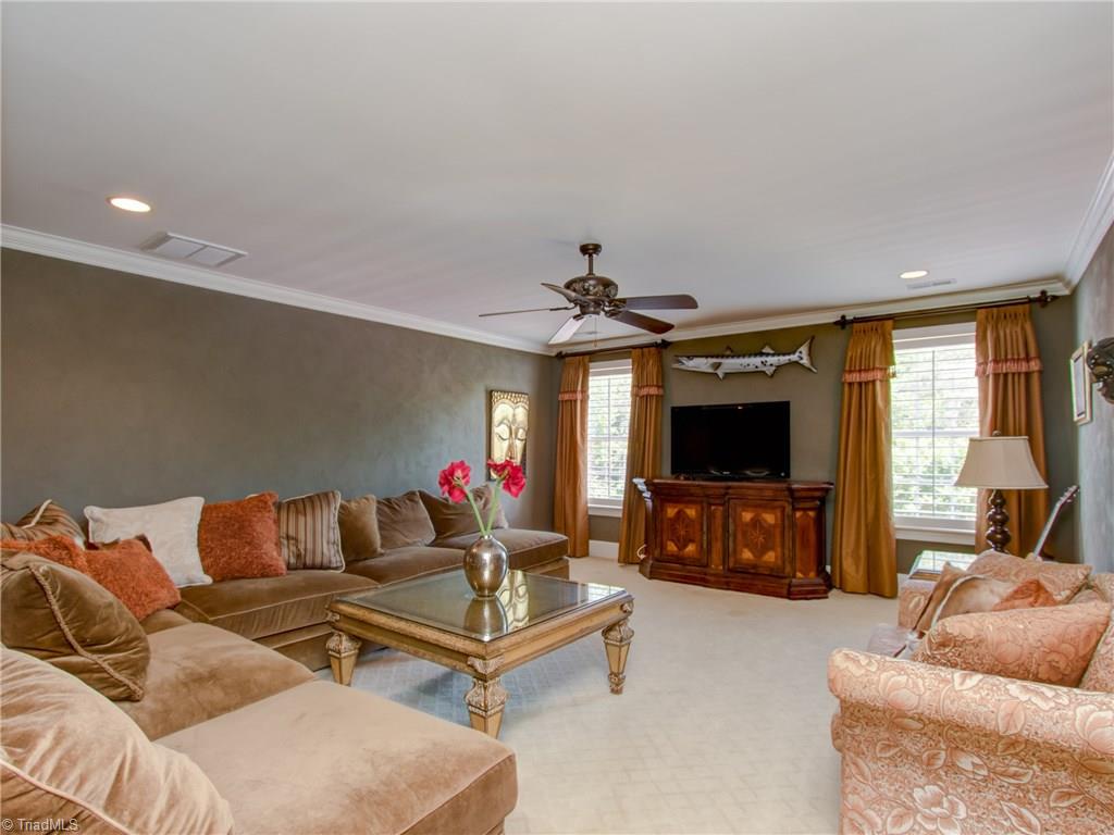 8404 Oakchester Court Oak Ridge, NC 27310 - Photo 19 of 30 Media room with custom window treatments.