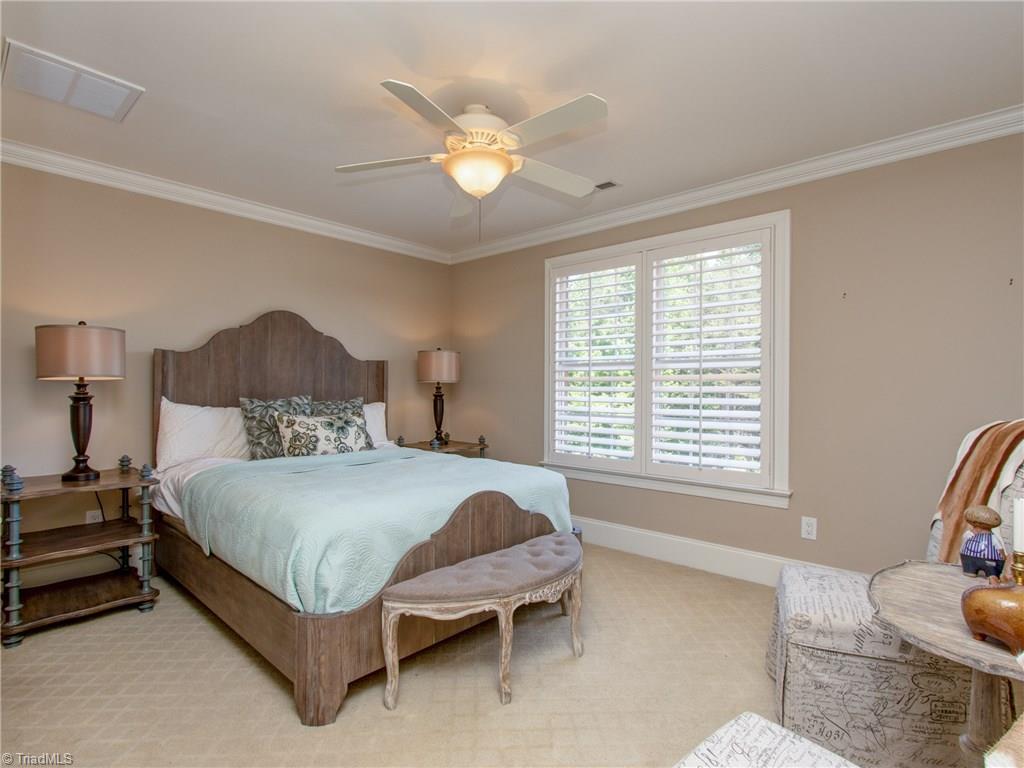 8404 Oakchester Court Oak Ridge, NC 27310 - Photo 20 of 30 Second bedroom with reach in closet with shelving. Jack and Jill bath.