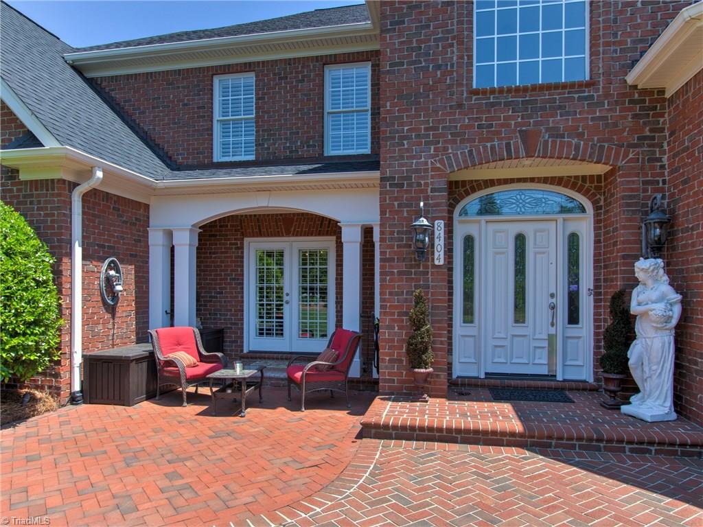 8404 Oakchester Court Oak Ridge, NC 27310 - Photo 3 of 30 Front porch and beautiful solid wood front door.