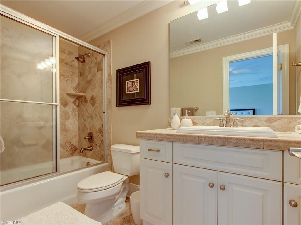 8404 Oakchester Court Oak Ridge, NC 27310 - Photo 24 of 30 Full bathroom with tub and shower combo.