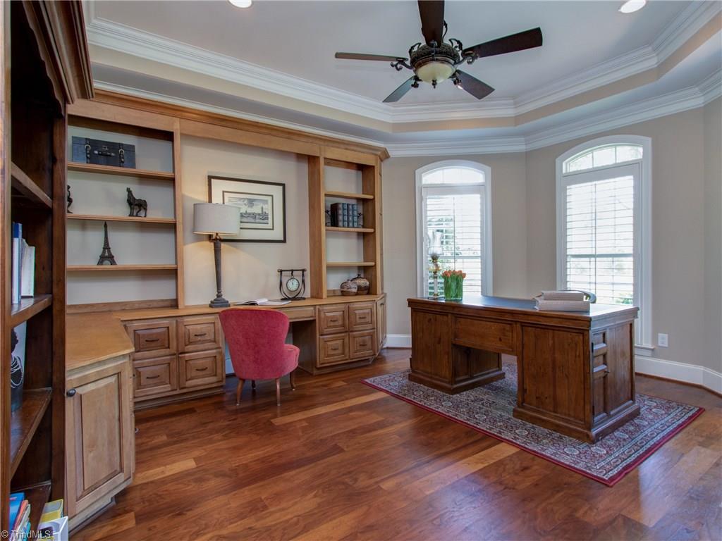 8404 Oakchester Court Oak Ridge, NC 27310 - Photo 5 of 30 French doors with transom open up to the office with built-in cabinetry, tray ceiling and crown molding.