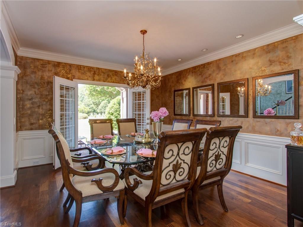 8404 Oakchester Court Oak Ridge, NC 27310 - Photo 6 of 30 Elegant dining room with beautiful molding, french doors and crystal 9 tier chandelier.