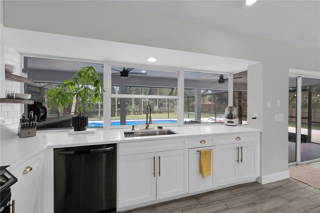 1950 Southwest Logwood Road Port St. Lucie, FL 34953 - Photo 8 of 32 a kitchen with sink and window