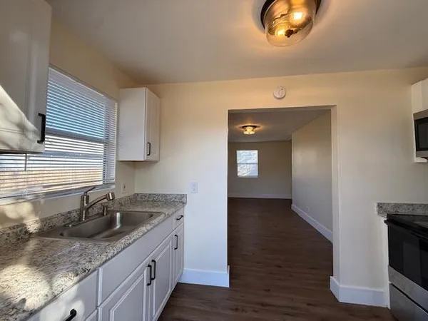 a kitchen with a sink and cabinets