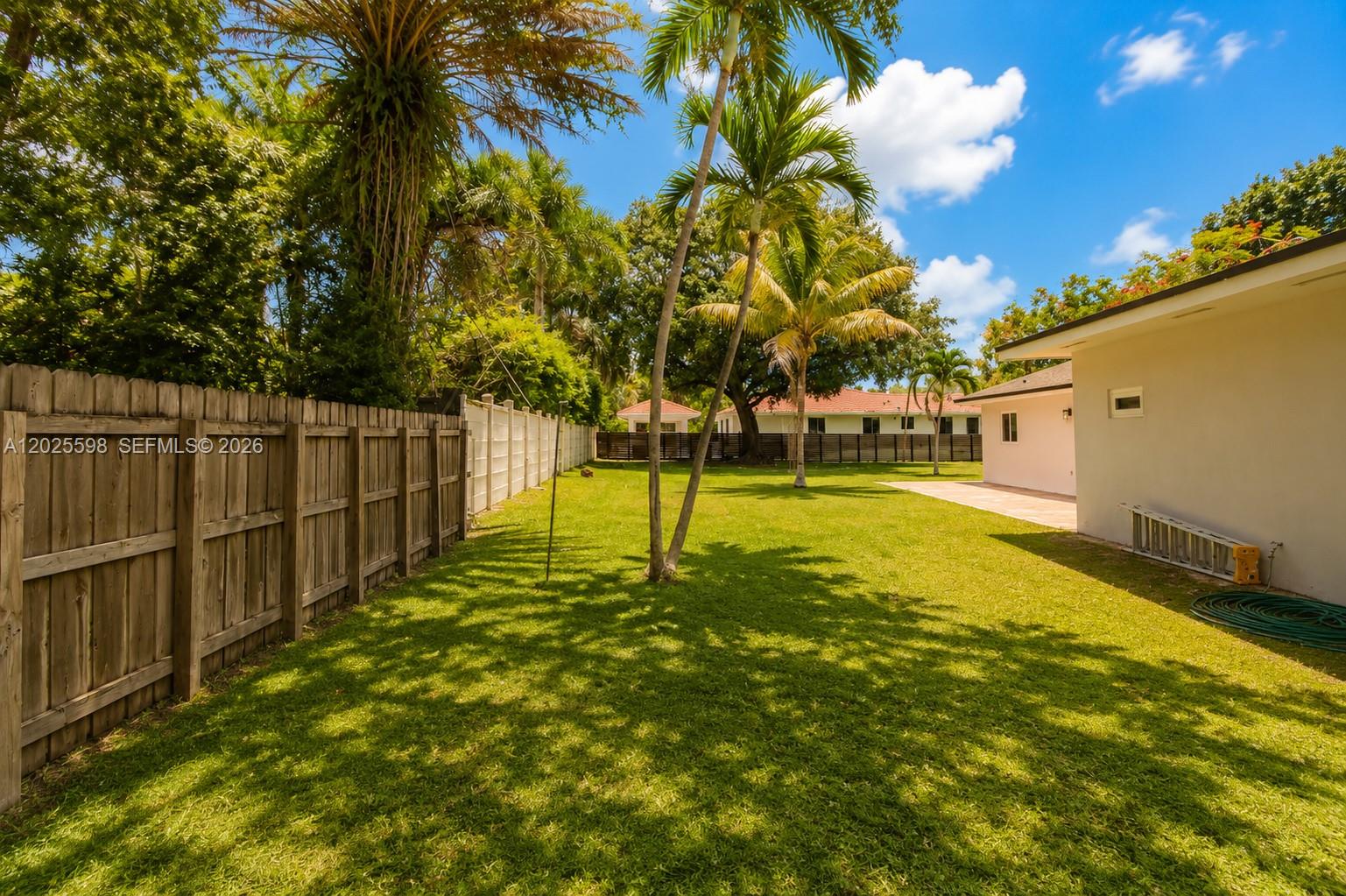 9421 Southwest 150th Street Miami, FL 33176 - Photo 27 of 31 a view of a yard with swimming pool