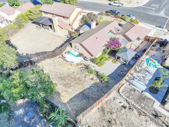 a view of a street with cars on the road