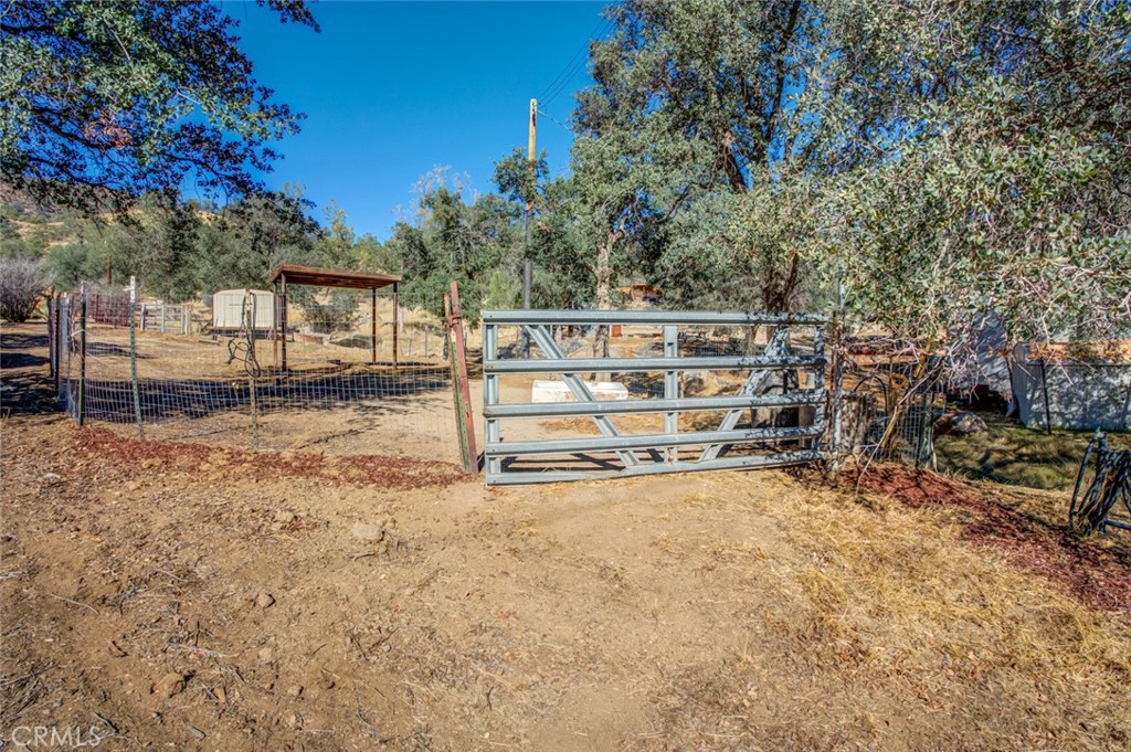 245 Mountain Shadow Road Wofford Heights, CA 93285 - Photo 39 of 72 a view of a yard with wooden fence