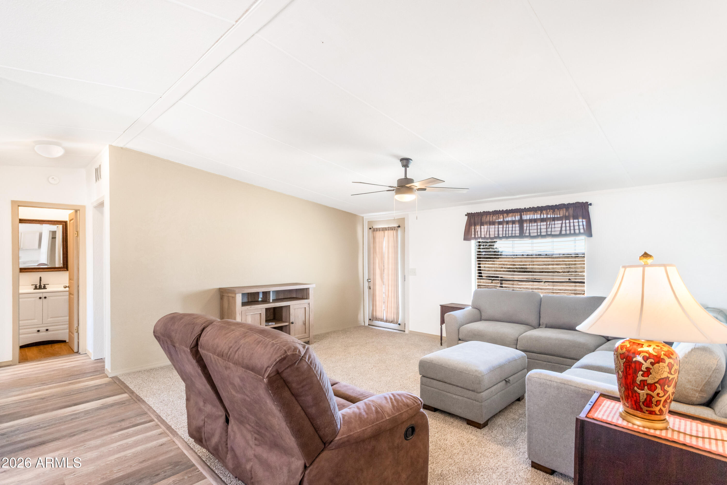 10405 North Mormon Road Elfrida, AZ 85610 - Photo 9 of 43 a living room with furniture and a flat screen tv