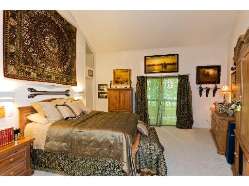 2610 Spring Creek Road Rockford, IL 61107 - Photo 7 of 15 a bedroom with a bed and a television