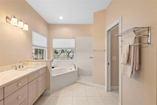 a view of a room with wooden floor and white walls