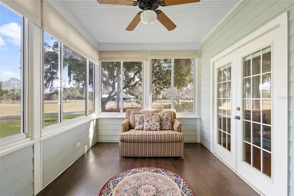a view of balcony with wooden floor and outdoor seating