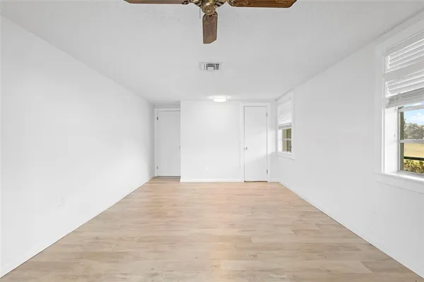 a view of a street with wooden floor