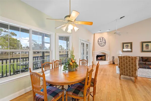 a large kitchen with stainless steel appliances a sink and a refrigerator