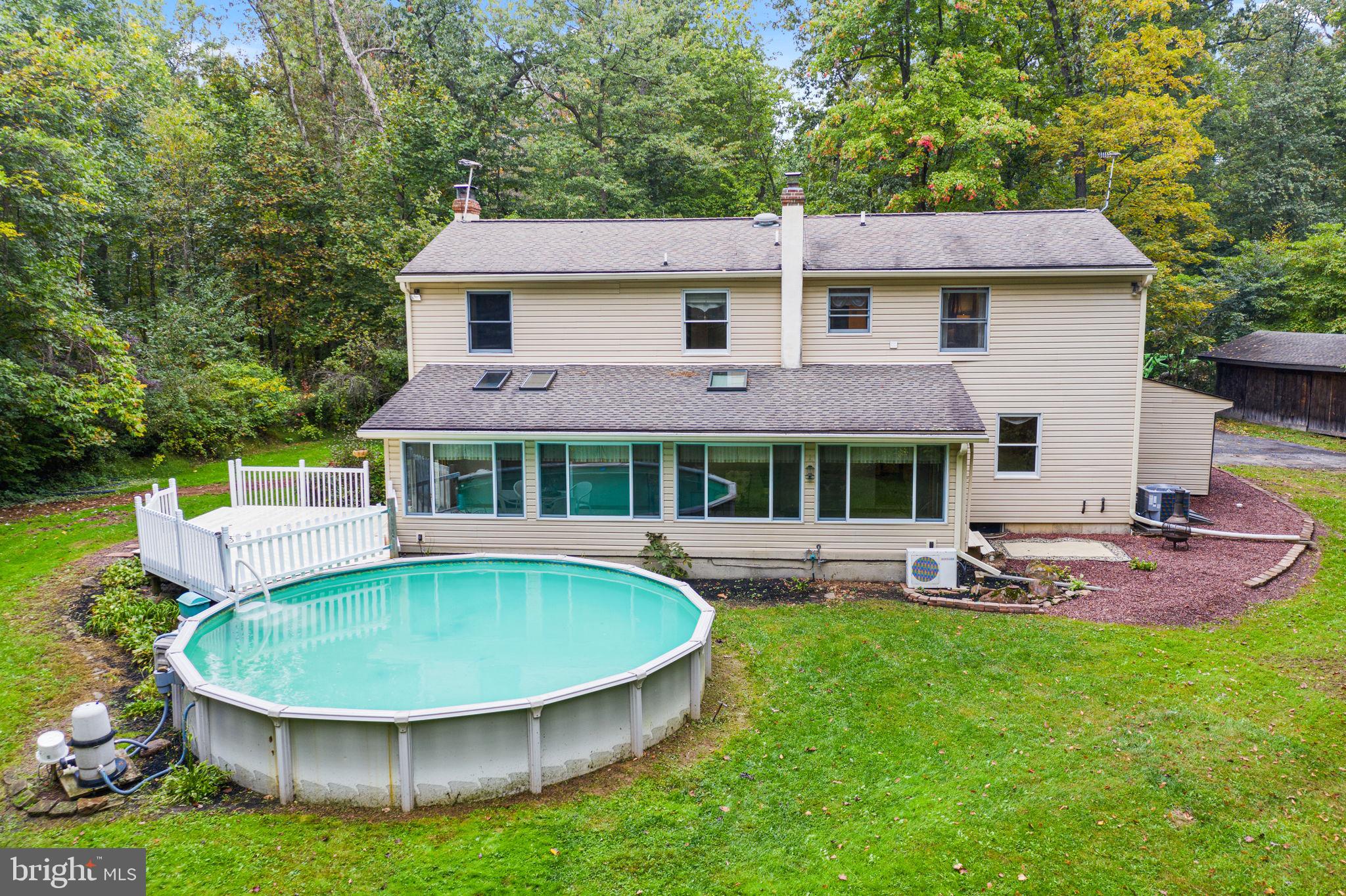 1447 Reed Lane Kintnersville, PA 18930 - Photo 30 of 39 Exterior Rear View with Deck & Pool
