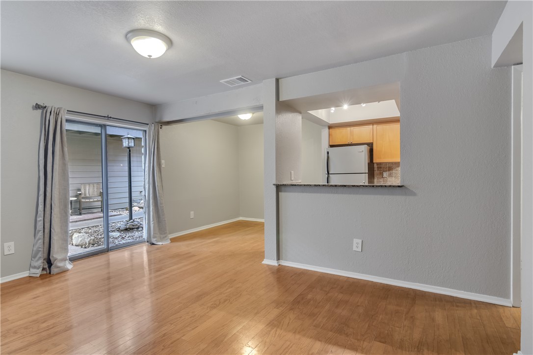 3627 Menchaca Road, Unit 112 Austin, TX 78704 - Photo 3 of 25 Dining room is on the left. Breakfast bar at pass through to kitchen.