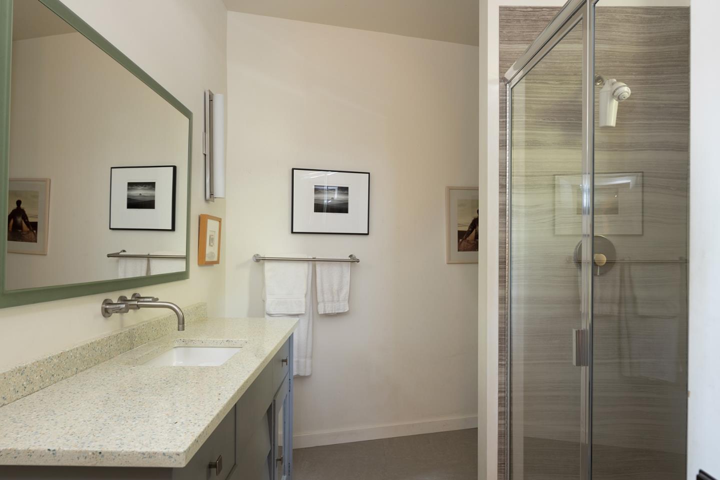 209 Crest Road Carmel, CA 93923 - Photo 11 of 35 a bathroom with a granite countertop sink a shower and a mirror