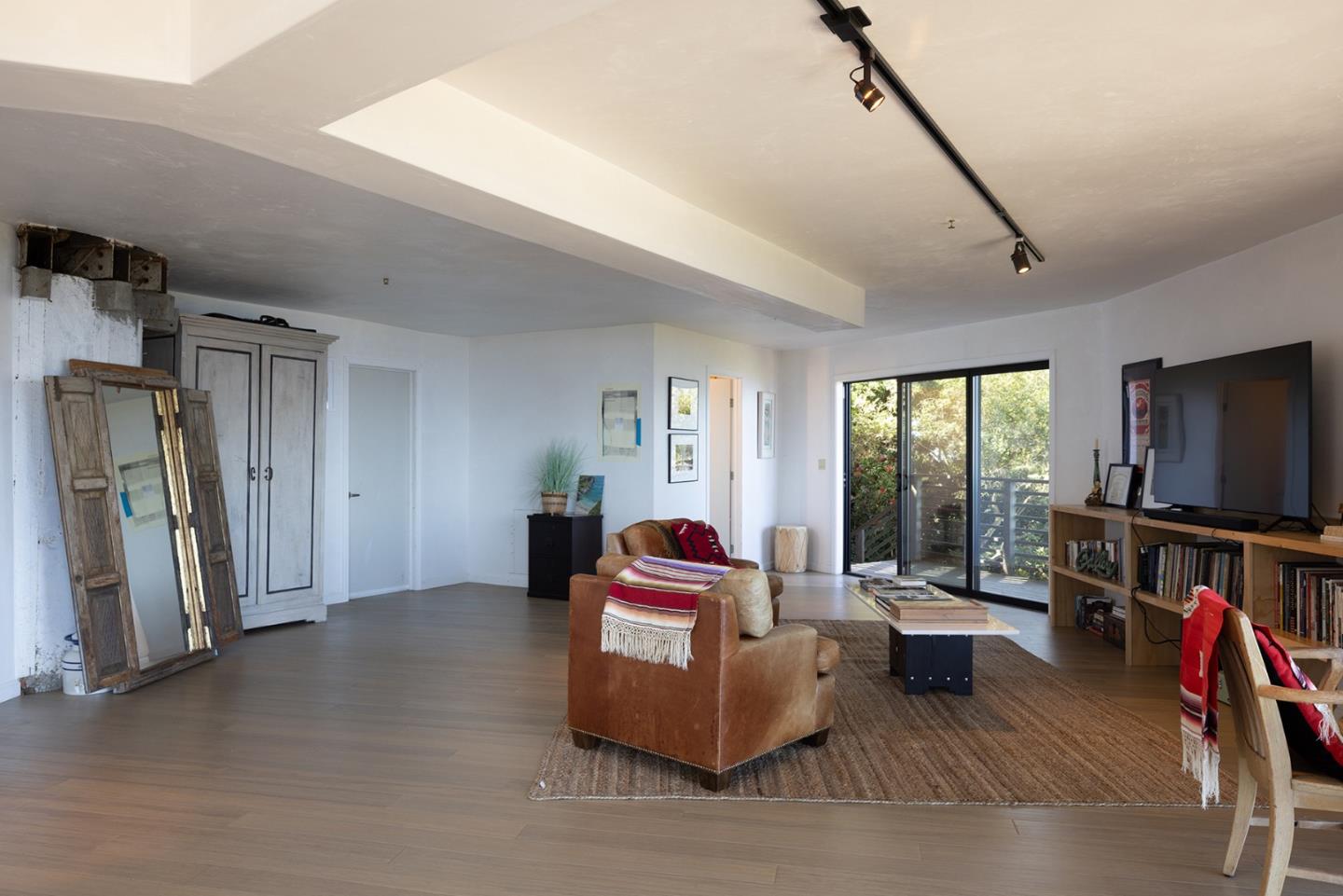 209 Crest Road Carmel, CA 93923 - Photo 21 of 35 a living room with furniture and a flat screen tv