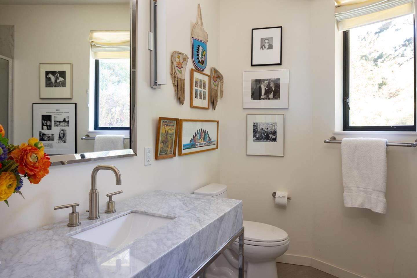 209 Crest Road Carmel, CA 93923 - Photo 8 of 35 a bathroom with a toilet sink and mirror
