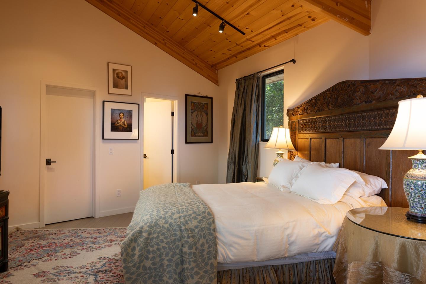 209 Crest Road Carmel, CA 93923 - Photo 9 of 35 a bedroom with a bed and wooden floor