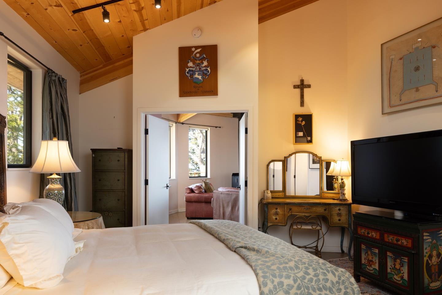 209 Crest Road Carmel, CA 93923 - Photo 10 of 35 a bedroom with a bed and a flat screen tv