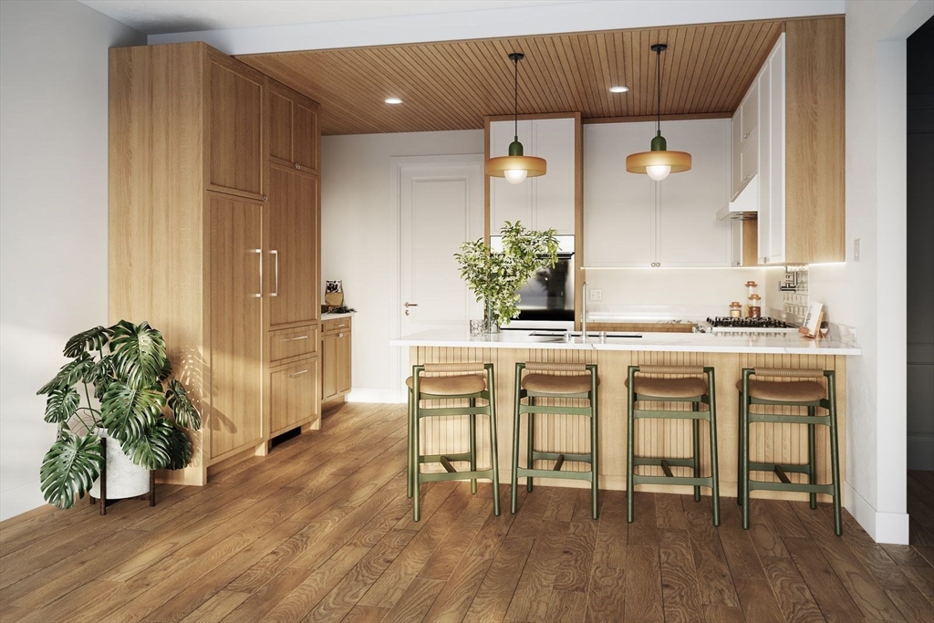 975 Washington Street, Unit 107 Newton, MA 02460 - Photo 3 of 8 a dining room with furniture and wooden floor