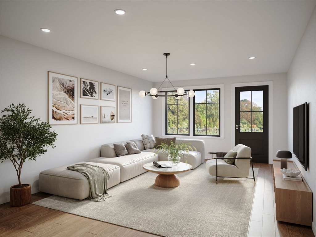 975 Washington Street, Unit 107 Newton, MA 02460 - Photo 4 of 8 a living room with furniture and a flat screen tv