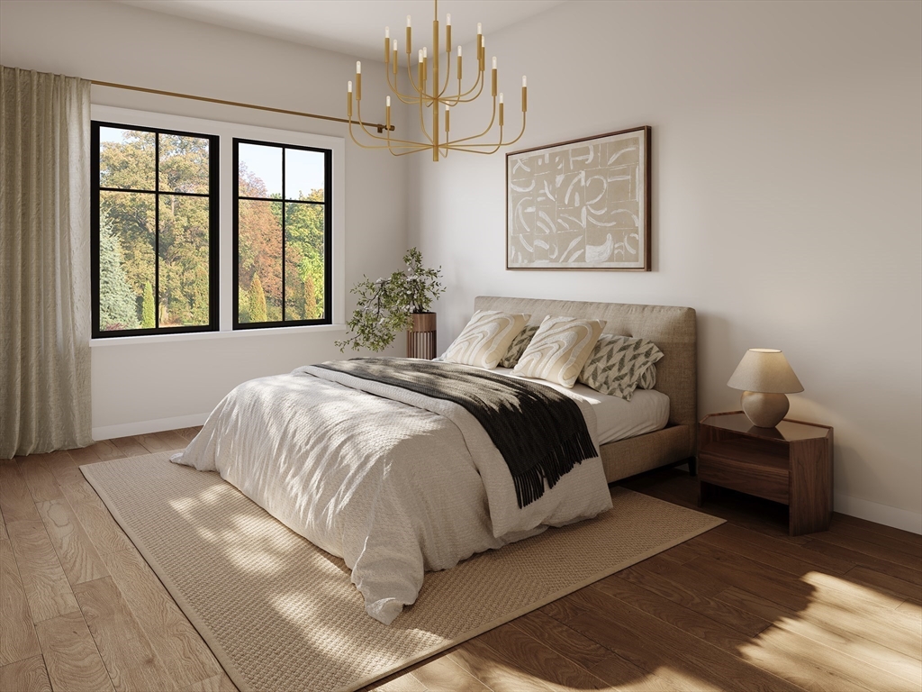 975 Washington Street, Unit 107 Newton, MA 02460 - Photo 6 of 8 a bedroom with a bed painting and window