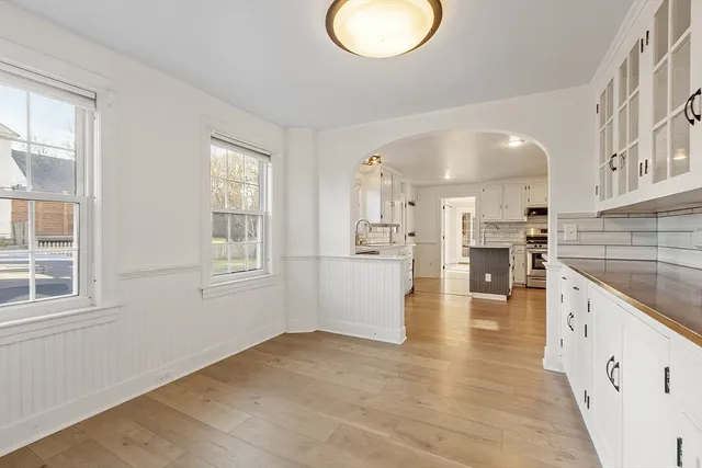 an empty room with windows and closet