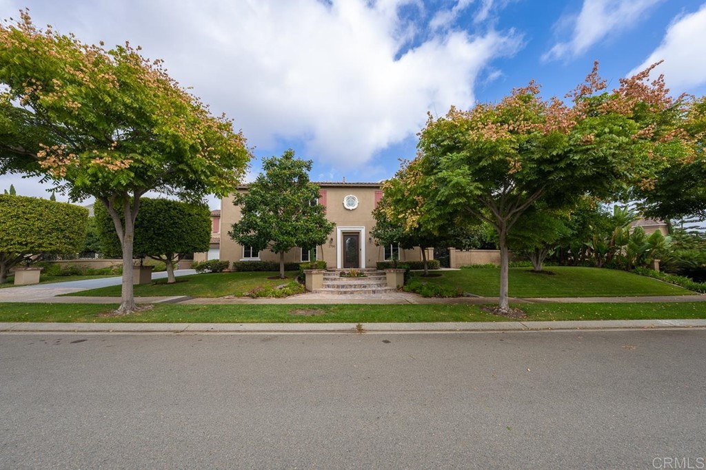 2786 Sutter Ridge Drive Chula Vista, CA 91914 - Photo 2 of 58 a front view of a house with garden and trees